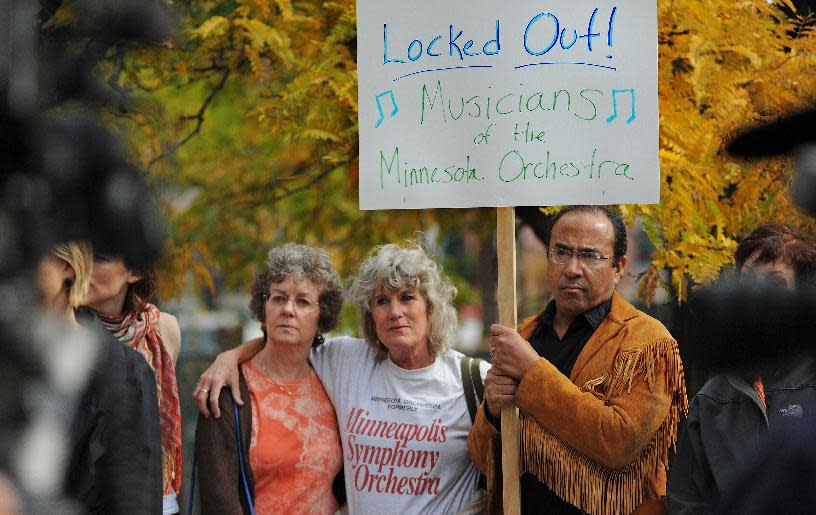 In this photo taken Monday Oct. 1, 2012, Minnesota Orchestra musicians locked out in contract dispute rally at 11th St and Nicollet Mall near Peavey Plaza In Minneapolis, Minn. The Minnesota Orchestra was called the world's greatest not long ago, welcome recognition for musicians outside a top cultural center. Now its members are locked out of Orchestra Hall, stuck in the same kind of labor-management battle recently afflicting teachers and football referees. (AP Photo/The Star Tribune, Richard Sennott)