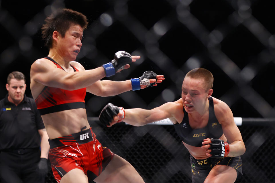 NEW YORK, NEW YORK - NOVEMBER 06: (R-L) Rose Namajunas punches Zhang Weili in their strawweight title bout during the UFC 268 event at Madison Square Garden on November 06, 2021 in New York City. (Photo by Mike Stobe/Getty Images)