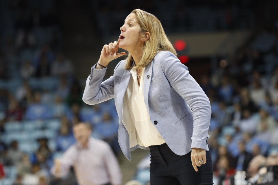 North Carolina head coach Courtney Banghart directs her players during the first half of an NCAA college basketball game against Louisville in Chapel Hill, N.C., Sunday, Jan. 19, 2020. (AP Photo/Gerry Broome)