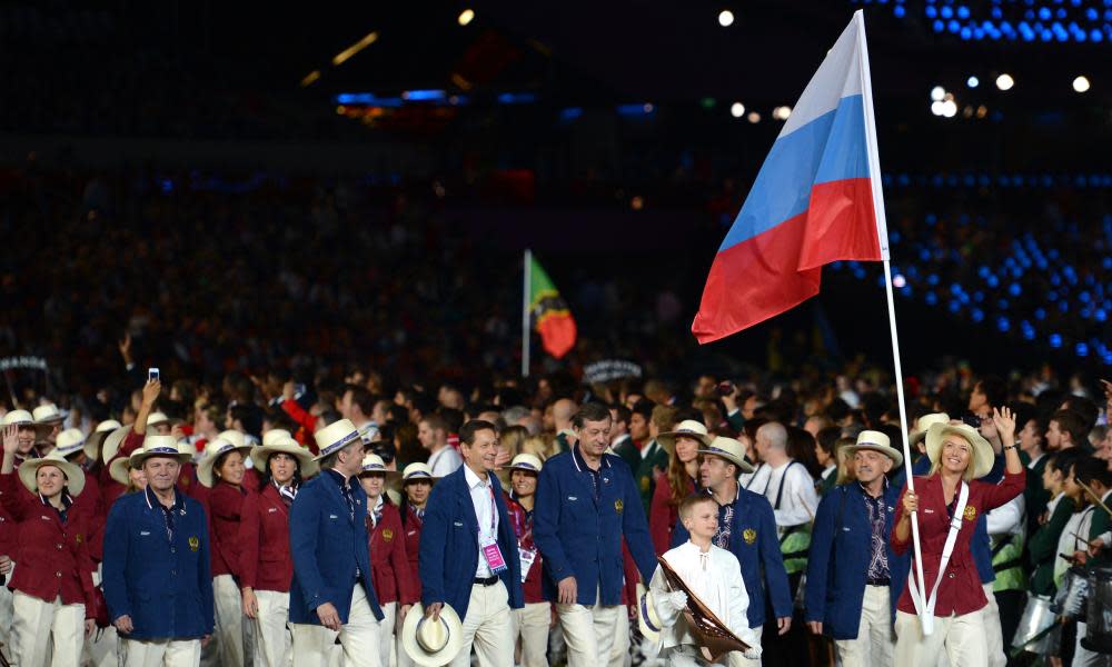 Maria Sharapova carries her country’s flag during the London 2012 opening ceremony.