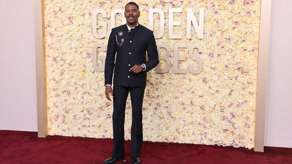 Nominated for his role in “Rustin,” Colman Domingo wore a black mandarin collar custom Louis Vuitton jacket with pearl buttons, tuxedo flared pants, black loafers and two golden brooches. - Mike Blake/Reuters