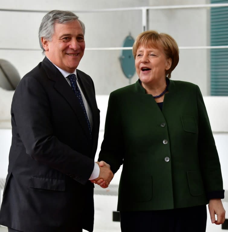 German Chancellor Angela Merkel shakes hands with Antonio Tajani, President of the European Parliament, in Berlin in February