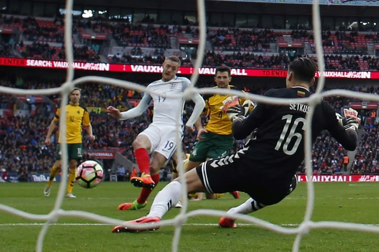 England's Jamie Vardy shoots past Lithuania's goalkeeper Ernestas Setkus to score their second goal during the Russia 2018 World Cup qualification match, at Wembley Stadium in London, on March 26, 2017