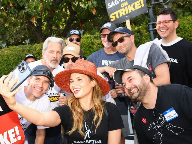 <p>VALERIE MACON/AFP/Getty</p> The cast and crew of 'NCIS' join members of the Writer's Guild of America and the Screen Actors Guild picket line on August 1, 2023 in Burbank, California.