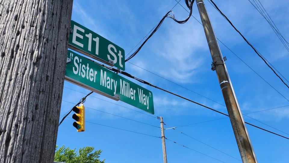 This sign at the southeast corner of East 11th and Holland Streets, unveiled Monday afternoon, designates a portion of East 11th Street as "Sister Mary Miller Way" to honor Miller, who served as director of Emmaus Soup Kitchen, 218 E. 11th St., from 1981 until her death in May 2023 at the age of 81.
