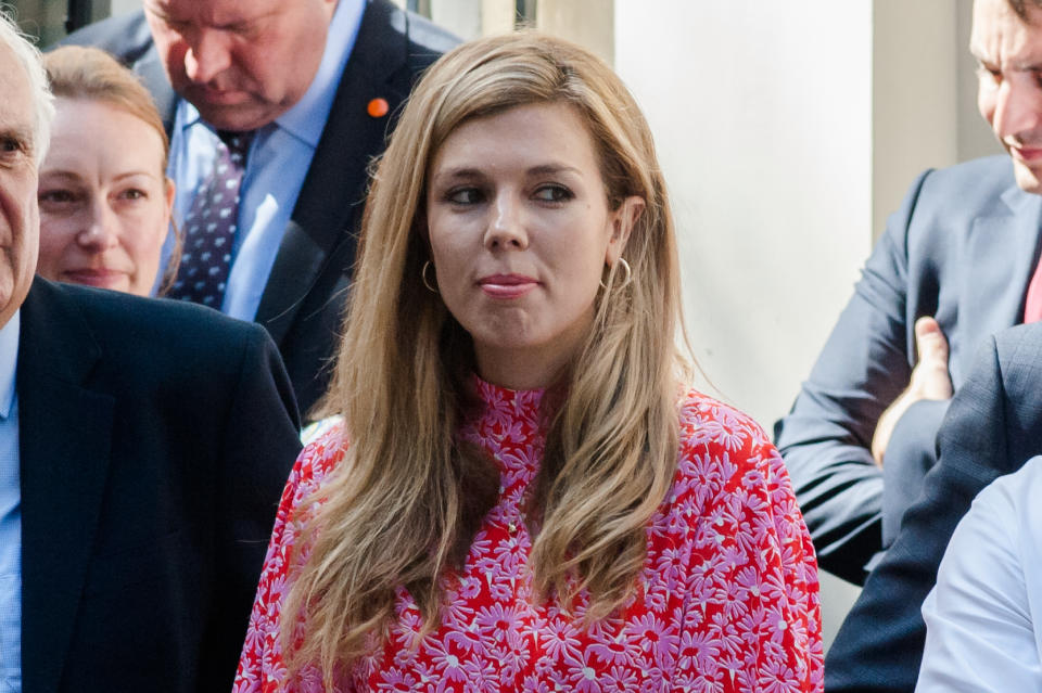 Carrie Symonds, Boris Johnson's partner, stands in Downing Street as Boris Johnson arrives to deliver his first speech as the new Prime Minister of the United Kingdom on 24 July, 2019 in London, England. Boris Johnson succeeds Theresa May as prime minister following a landslide victory in the Conservative Party leadership contest. (Photo by WIktor Szymanowicz/NurPhoto via Getty Images)