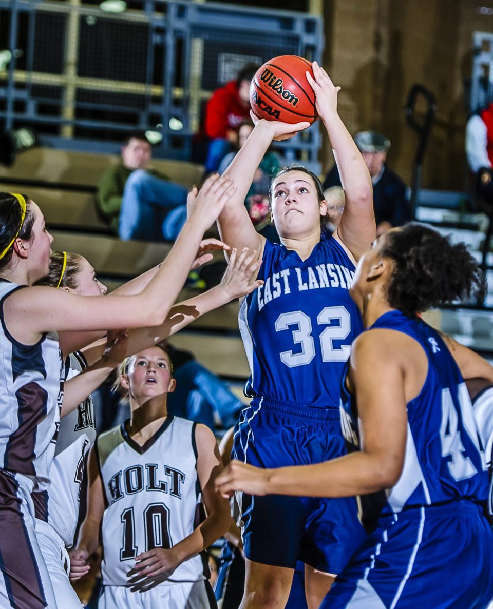 Grace Whelan (32) of East Lansing stops during a game against Holt in December 2012. The former four-year Trojan varsity player was announced as East Lansing's girls basketball coach Monday.