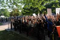 Protestors peacefully protest minutes before riot police cleared them away for a photo opportunity by President Donald Trump in Washington