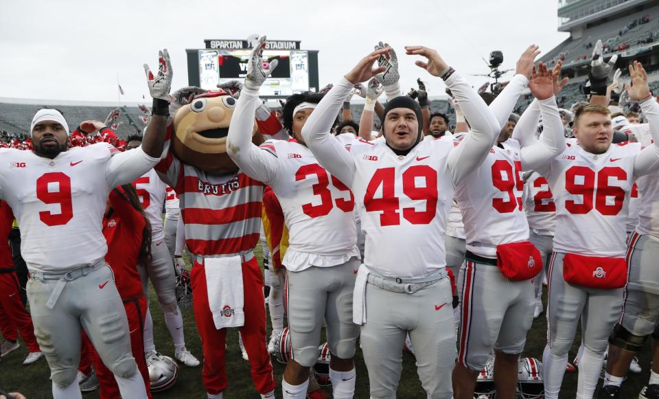 Ohio State players sing "Carmen Ohio" after their NCAA college football game against the Michigan State, Saturday, Nov. 10, 2018, in East Lansing, Mich. (AP Photo/Carlos Osorio)