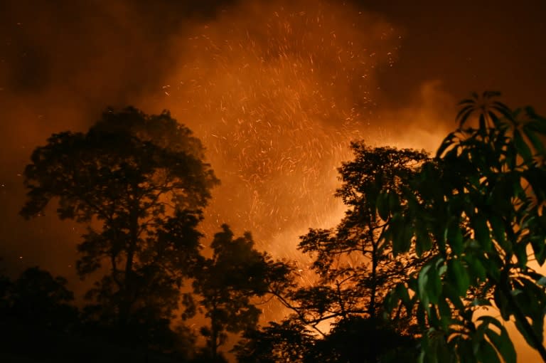 A wild fire burns near the village of Lubhu in Lalitpur district, on the outskirts of Kathmandu, overnight on May 1, 2024 (PRAKASH MATHEMA)
