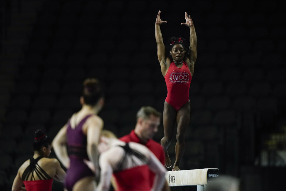 Simone Biles, a seven-time Olympic medalist and the 2016 Olympic champion, practices on the balance beam at the U.S. Classic gymnastics competition Friday, Aug. 4, 2023, in Hoffman Estates, Ill. (AP Photo/Morry Gash)