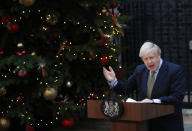 Britain's Prime Minister Boris Johnson addresses the media outside 10 Downing Street in London, Friday, Dec. 13, 2019. Johnson's Conservative Party has won a thumping majority of seats in Britain's Parliament — a decisive outcome to a Brexit-dominated election that should allow Johnson to fulfill his plan to take the U.K. out of the European Union next month.(AP Photo/Frank Augstein)