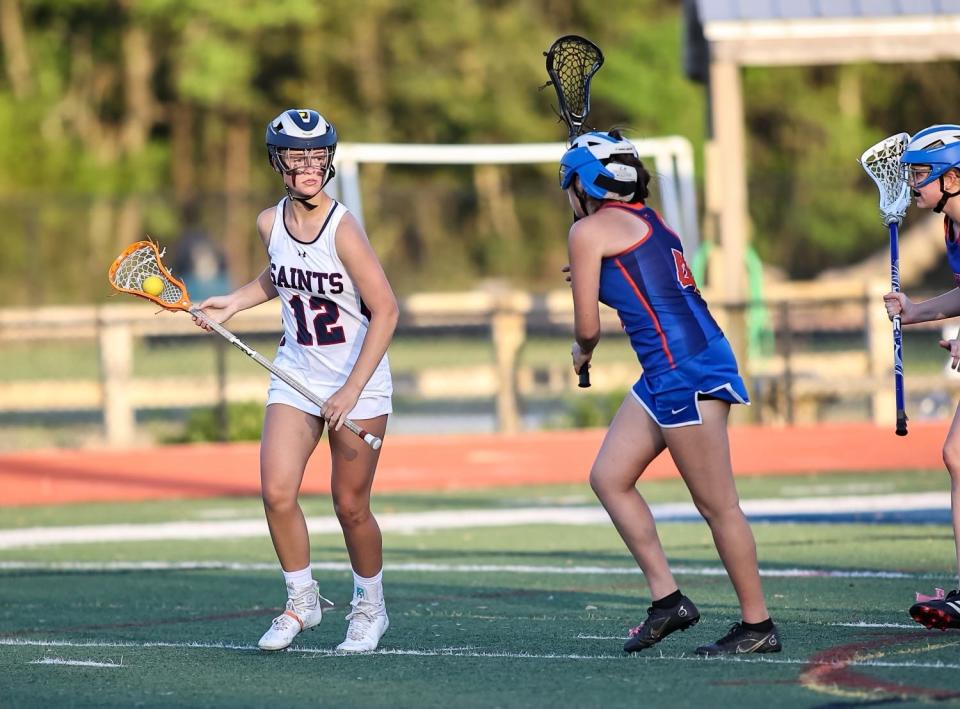 All Saints midfielder Sara Williams, left, competes in a contest in 2023. Williams is eager to get back her squad to the district championship.