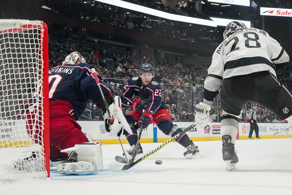 Dec 5, 2023; Columbus, Ohio, USA; Columbus Blue Jackets defenseman Jake Bean (22) and goaltender Elvis Merzlikins (90) prevent Los Angeles Kings center Jaret Anderson-Dolan (28) from scoring during the second period of the NHL game at Nationwide Arena.