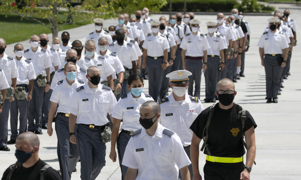 A formation of new cadets marches, Monday, July 13, 2020, at the U.S. Military Academy in West Point, N.Y. The Army is welcoming more than 1,200 candidates from every state. Candidates will be COVID-19 tested immediately upon arrival, wear masks, and practice social distancing. (AP Photo/Mark Lennihan)