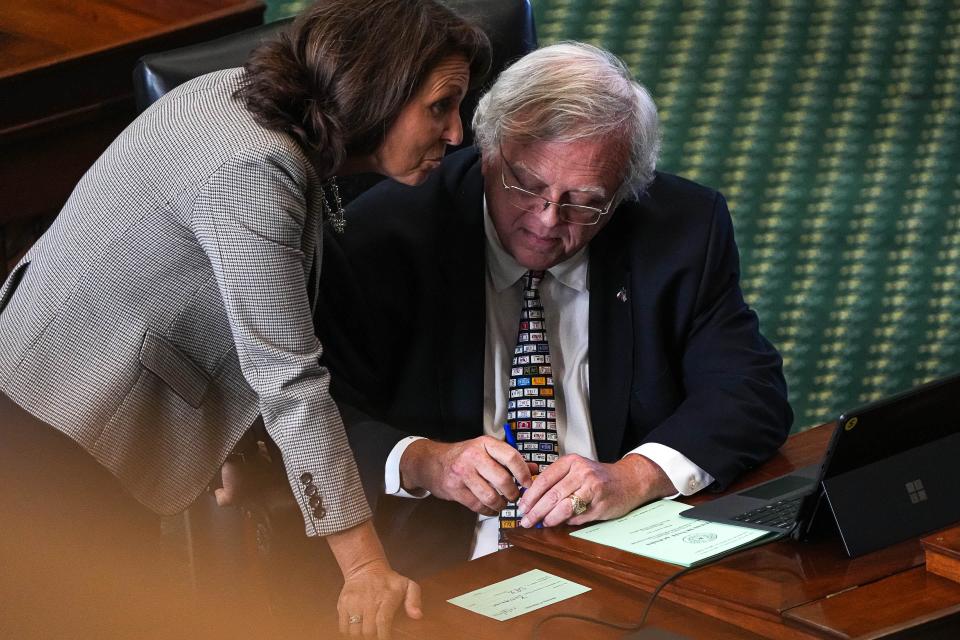 Sen. Paul Bettencourt, shown speaking with Sen. Angela Paxton at the Capitol last fall, sought the change in how appraisal boards are governed.