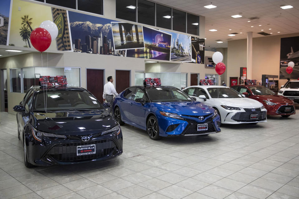 FILE - In this Feb. 14, 2019, file photo, Toyota sedans are displayed in a showroom at Puente Hills Toyota in Industry, Calif. This summer, the best deals will be found on a dealership's pre-owned lot. Because the price gap between new and used cars is widening, buying a used car now makes more sense than it did just a few years ago. (AP Photo/Jae C. Hong, File)