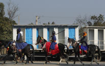 Nihangs or a Sikh warriors arrive on horses at Singhu, the Delhi-Haryana border camp for protesting farmers against three farm bills, in New Delhi, India, Wednesday, Jan. 27, 2021. Leaders of a protest movement sought Wednesday to distance themselves from a day of violence when thousands of farmers stormed India's historic Red Fort, the most dramatic moment in two months of demonstrations that have grown into a major challenge of Prime Minister Narendra Modi’s government. (AP Photo/Manish Swarup)