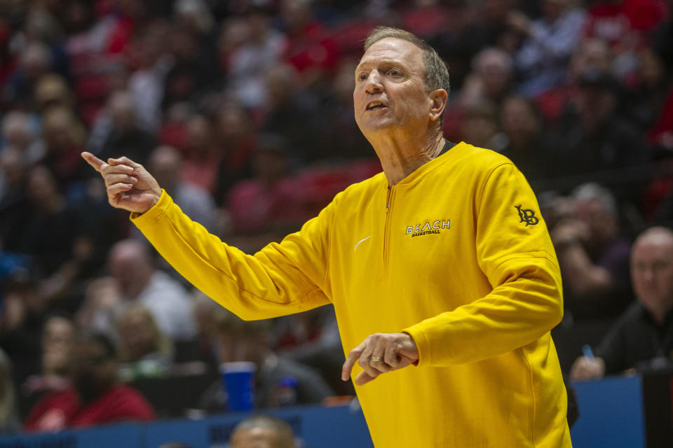 SAN DIEGO, CA - NOVEMBER 14: Long Beach State head coach Dean Monson takes the court during the first half of a college basketball game between Long Beach State and San Diego State, Tuesday, November 14, 2023, at Viejas Arena in San Diego, California. Pointing to the side.  .  (Photo by Tony Ding/ICON Sportswire via Getty Images)