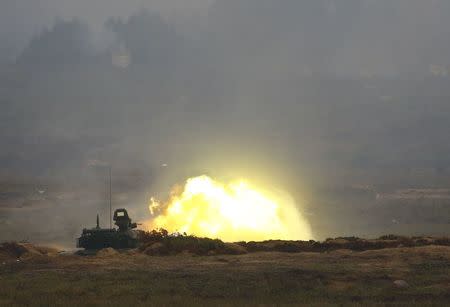 An armoured vehicle fires during the Zapad 2017 war games at a range near the town of Borisov, Belarus September 20, 2017. REUTERS/Vasily Fedosenko