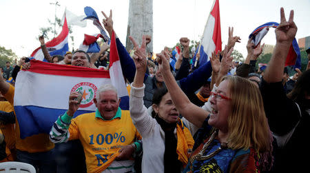 People celebrate rejection of the amendment in front of the Congress after members discuss during a session at the Lower House amendment to allow presidential second terms of Congress in Asuncion, Paraguay April 26, 2017. REUTERS/Jorge Adorno