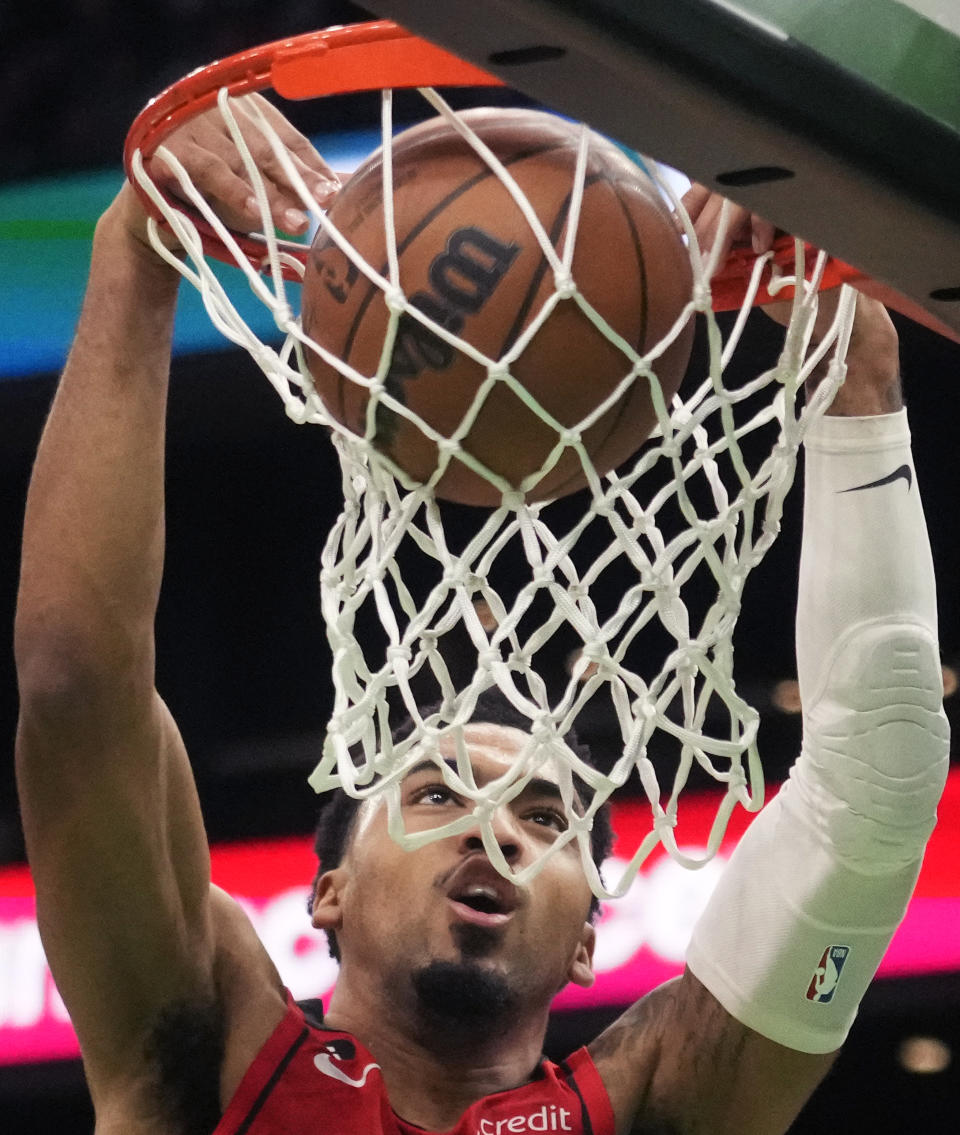 Houston Rockets forward Kenyon Martin Jr. slams a dunk against the Boston Celtics during the second half of an NBA basketball game, Tuesday, Dec. 27, 2022, in Boston. (AP Photo/Charles Krupa)