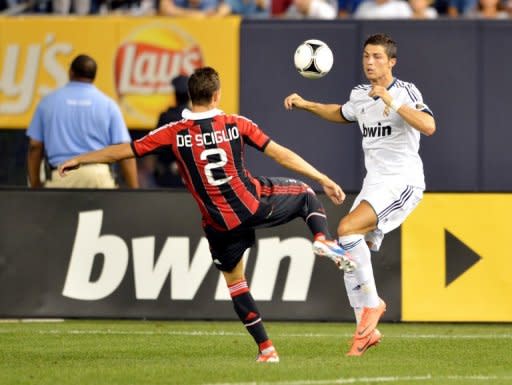 Cristiano Ronaldo (right) clashes with AC Milan's Mattia De Sciglio in a friendly at Yankee Stadium in New York last week. Real Madrid won 5-1