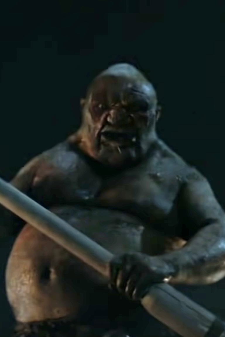 Large, troll-like creature holding a club from a fantasy setting