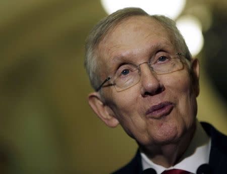 Senate Majority Leader Harry Reid (D-NV) speaks to reporters on the upcoming budget battle on Capitol Hill in Washington December 9, 2014. REUTERS/Gary Cameron