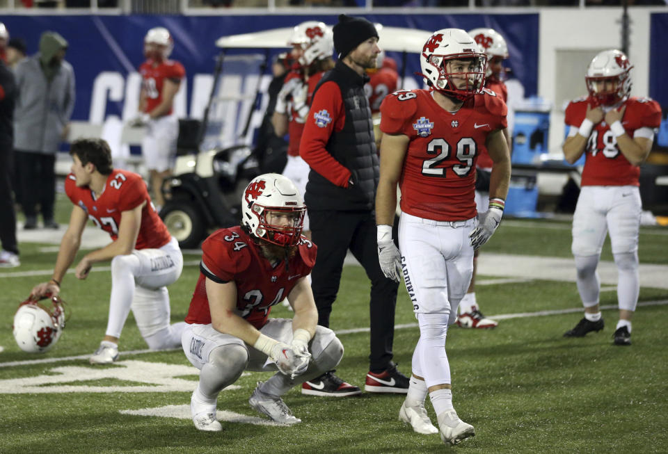 North Central players and coach react a loss to Cortland in the Amos Alonzo Stagg Bowl NCAA Division III championship football game in Salem, Va., Friday Dec. 15, 2023. (Matt Gentry/The Roanoke Times via AP)