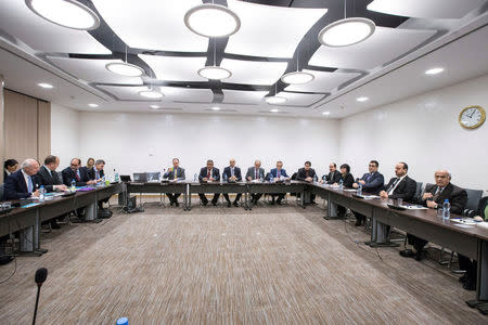 United Nations Special Envoy of the Secretary-General for Syria Staffan de Mistura, and Naser al-Hariri, Head of the Syrian Negotiation Commission (SNC), attend a round of negotiations during the Intra Syria talks, at the European headquarters of the U.N. in Geneva, Switzerland December 14, 2017. REUTERS/Xu Jinquan/Pool