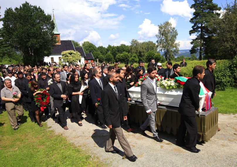 Mourners push the coffin of Bano Abobakar Rashid, 18, the first victim of the shooting rampage at Utoeya to be buried, at a church in Nesodden, near Oslo, Norway in 2011