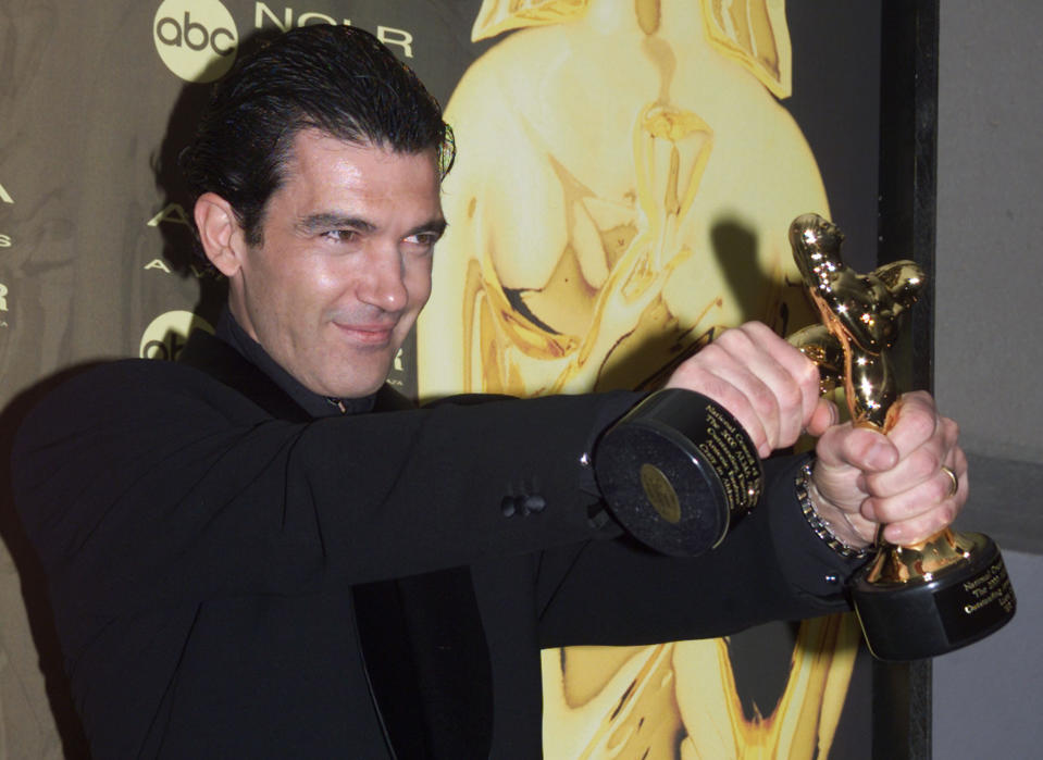 Actor/director Antonio Banderas poses for photographers with the two ALMA awards he won during the fifth annual American Latino Media Arts Awards April 16 in Pasadena. Banderas won for outstanding actor in a feature film for his role in "The 13th Warrior", and for outstanding director of a feature film for "Crazy in Alabama." The awards honor the positive portrayal of Latino images in American film, television and [music], and will be telecast in the United States on the ABC television network June 17.