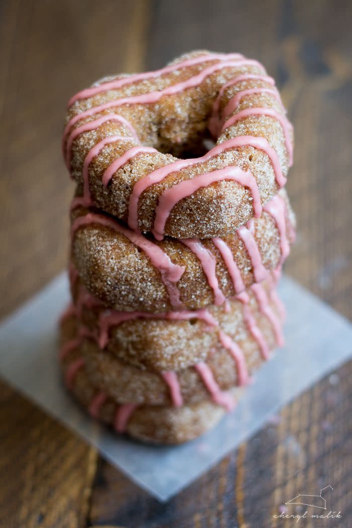 <p>A pretty pink pomegranate glaze adds a tart bite to these doughnuts. You'll love the extra fruit flavor.</p><p><strong>Get the recipe at <a href="https://40aprons.com/baked-apple-cider-donuts-with-pomegranate-glaze-vegan/" rel="nofollow noopener" target="_blank" data-ylk="slk:40 Aprons;elm:context_link;itc:0;sec:content-canvas" class="link ">40 Aprons</a>.</strong></p><p><strong><a class="link " href="https://www.amazon.com/Forvel-6-Cavity-Non-Stick-Heart-shaped-Metallic/dp/B0778MBGQH?tag=syn-yahoo-20&ascsubtag=%5Bartid%7C10050.g.28172487%5Bsrc%7Cyahoo-us" rel="nofollow noopener" target="_blank" data-ylk="slk:SHOP HEART-SHAPED DOUGHNUT PANS;elm:context_link;itc:0;sec:content-canvas">SHOP HEART-SHAPED DOUGHNUT PANS</a><br></strong></p>