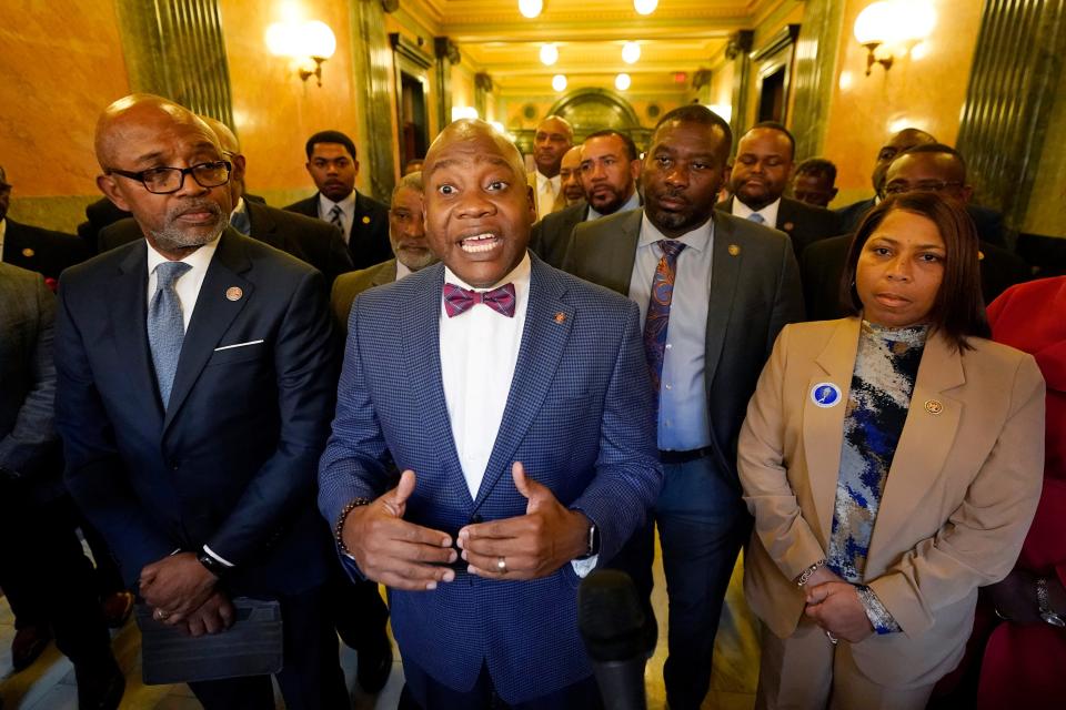 Black Democratic legislators stand with Mississippi Rep. Robert Johnson of Natchez, left, while state Sen. Derrick Simmons of Greenville, calls on the leadership of both chambers and the governor to make a greater effort to develop an economic development package that benefits the residents of the Mississippi Delta, shortly after the state Legislature passed a state incentives package for a Mississippi factory that will manufacture batteries for electric vehicles — a project that promises 2,000 jobs, during the special session of the Mississippi Legislature, Thursday, Jan. 18, 2024, at the Mississippi Capitol in Jackson.