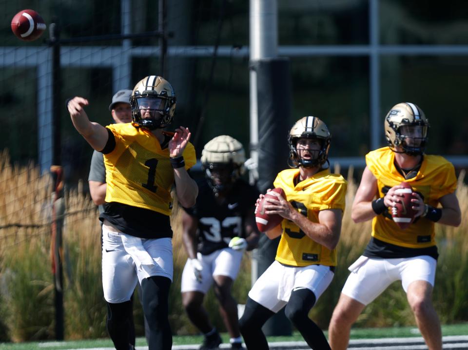 Purdue Boilermakers quarterback Hudson Card (1), Purdue Boilermakers quarterback Kyle Adams (19) and Purdue Boilermakers quarterback Bennett Meredith (18) run a drill during football practice, Thursday, Aug. 3, 2023, at Purdue University in West Lafayette, Ind. 