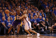 Lakers guard Kobe Bryant, left, backs down Thunder guard Derek Fisher on May 21 in Oklahoma City, Okla. (Photo by Ronald Martinez/Getty Images)