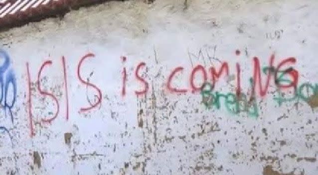 One of the images includes the teen making the jihadi salute, while another shows graffiti of the words “ISIS is coming”. Source: Supplied.