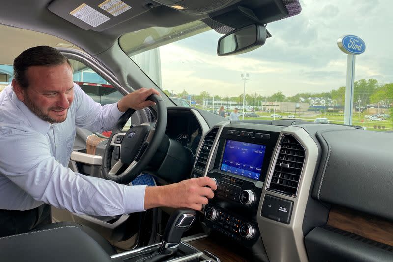 Noah Wolter, general manager of Charles Gabus Ford, shows off an F-Series truck in Des Moines