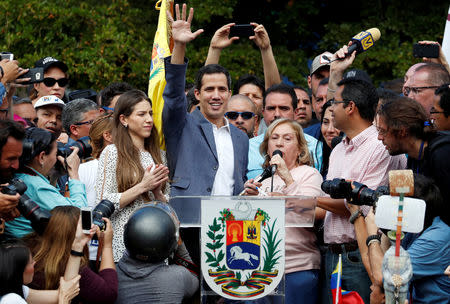 Venezuela's opposition leader Juan Guaido waves to his supporters during a rally with members of the Venezuela’s National Assembly regarding an amnesty law project for members of the military, in Caracas, Venezuela, January 26, 2019. REUTERS/Carlos Garcia Rawlins