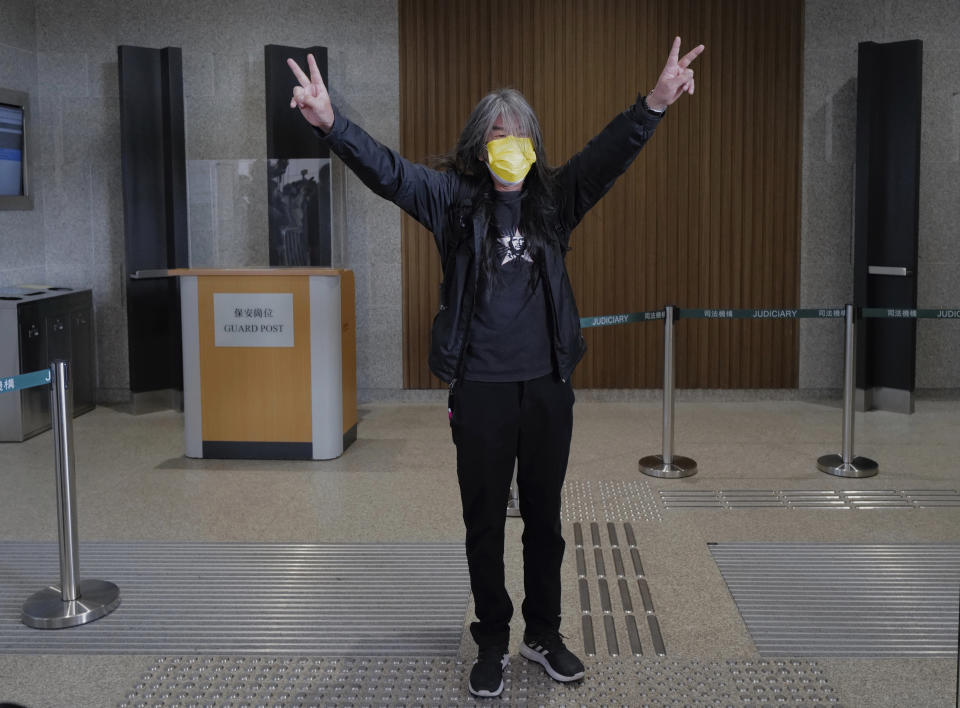 Hong Kong pro-democracy activists Leung Kwok-hung gestures as he arrives at a court in Hong Kong Tuesday, Feb. 16, 2021. Leung is among nine prominent Hong Kong's democracy advocates facing trial Tuesday on charges of organizing an unauthorized assembly in August 2019.(AP Photo/Vincent Yu)