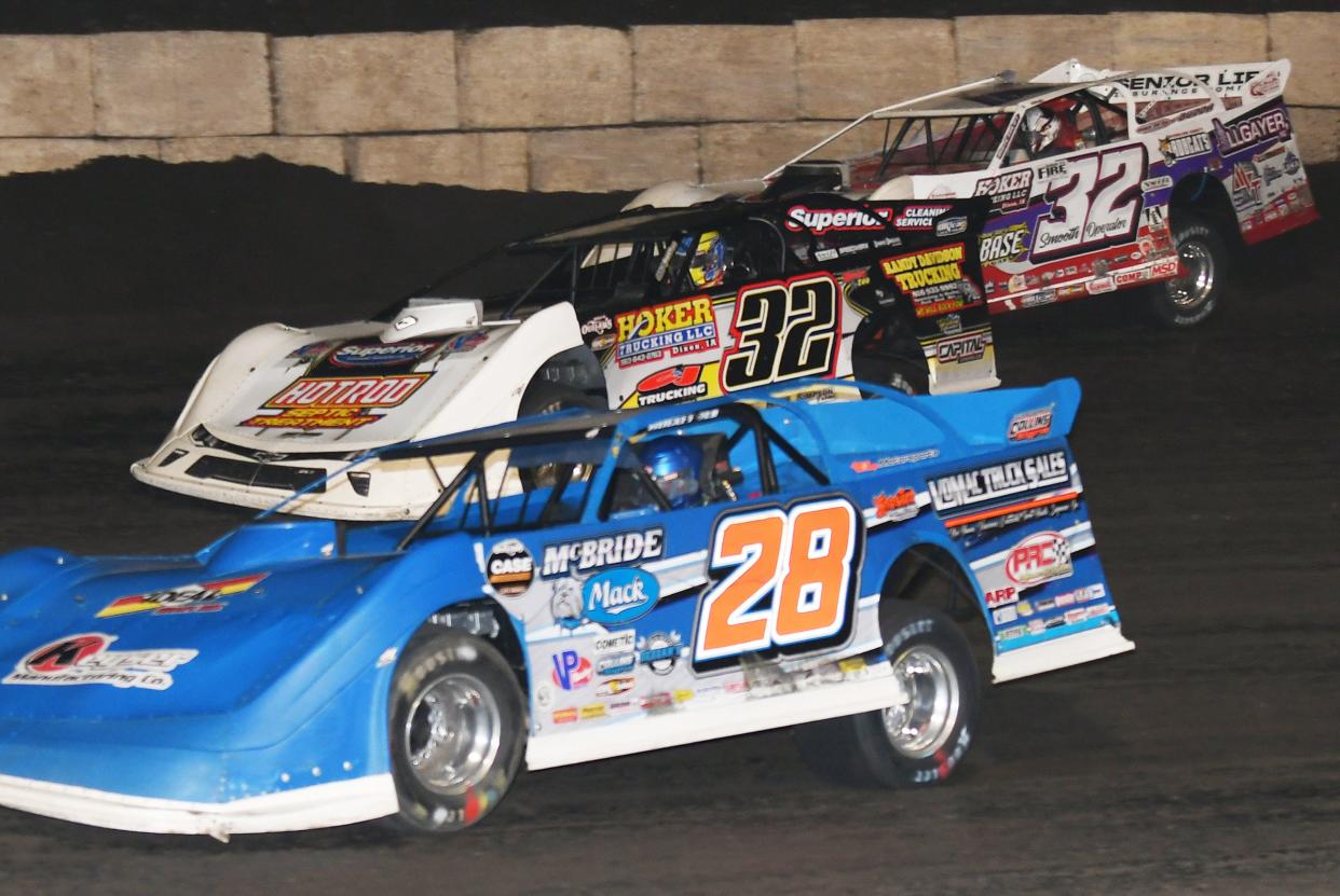 Dennis Erb Jr. (28), Chris Simpson (middle), and Bobby Pierce (32) race for the lead in the 50 lap DIRTcar Summer National race. Simpson went on to win the evening's main event.