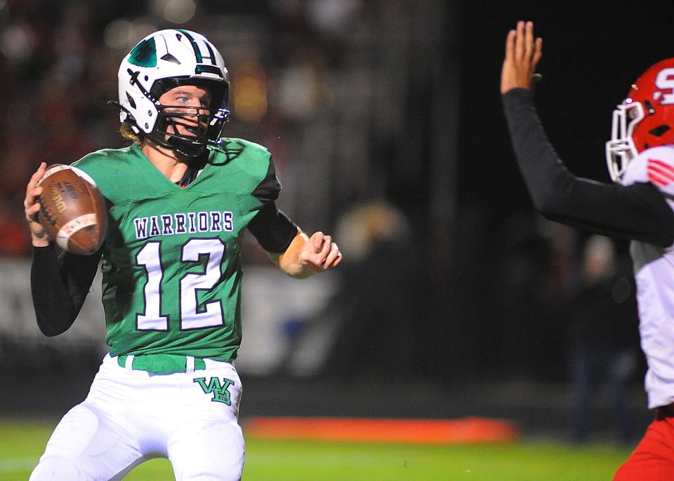 West Branch quarterback Dru DeShields prepares to pass over a Struthers defender during a Division IV regional quarterfinal at Clinton Heacock Stadium, Friday, Nov. 4, 2022.