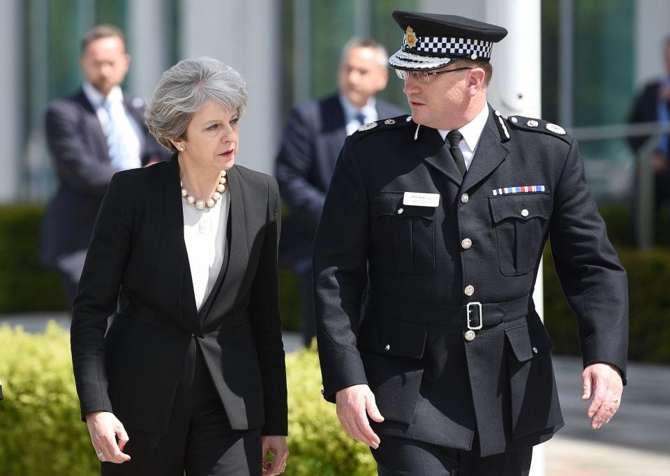 Theresa May (L) walks with Chief Constable of Greater Manchester Police, Ian Hopkins - Credit: OLI SCARFF/AFP/Getty Images