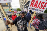 Jermaine Darnett, a cook at the MGM Grand Detroit, chants slogans as he walks the picket line during a strike in front of the casino, in Detroit, Tuesday, Oct. 17, 2023. (David Guralnick/Detroit News via AP)