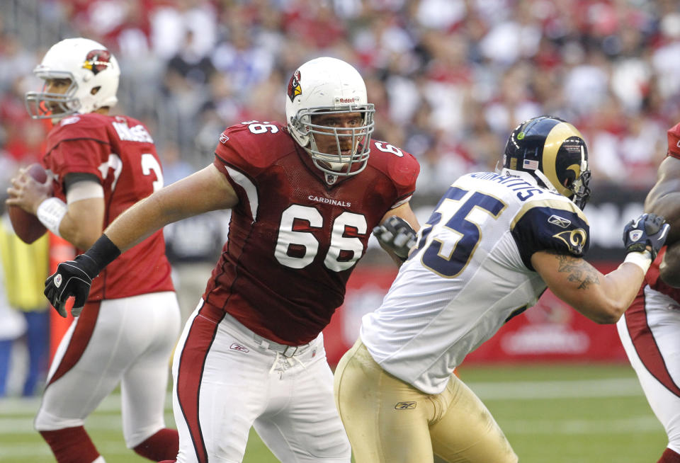 FILE - In this Dec. 5, 2010, file photo, Arizona Cardinals' Alan Faneca (66) blocks for quarterback Derek Anderson as St. Louis Rams' James Laurinaitis (55) moves to the right during an NFL football game in Glendale, Ariz. Faneca set the tone on the Steelers' offensive line during his 10 years in Pittsburgh and the six-time All-Pro guard did the same in two seasons with the New York Jets and one with the Arizona Cardinals. Faneca was elected to the Pro Football Hall of Fame in his sixth year of eligibility and it is an honor that many believe was a long time coming. (AP Photo/Ross D. Franklin, File)