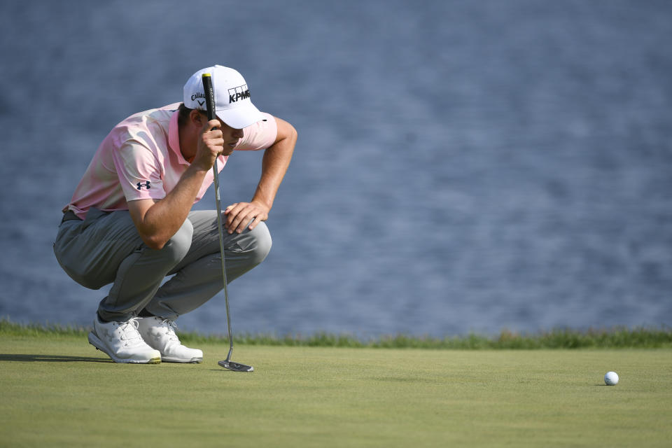 Maverick McNealy lines up a putt on the 18th hole during the third round of the 3M Open golf tournament in Blaine, Minn., Saturday, July 24, 2021. (AP Photo/Craig Lassig)