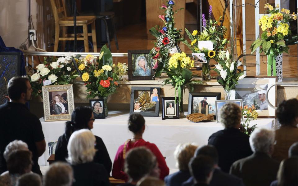 People attend memorial during Messe Reconfort at Sainte-Agnes church in Lac-Megantic