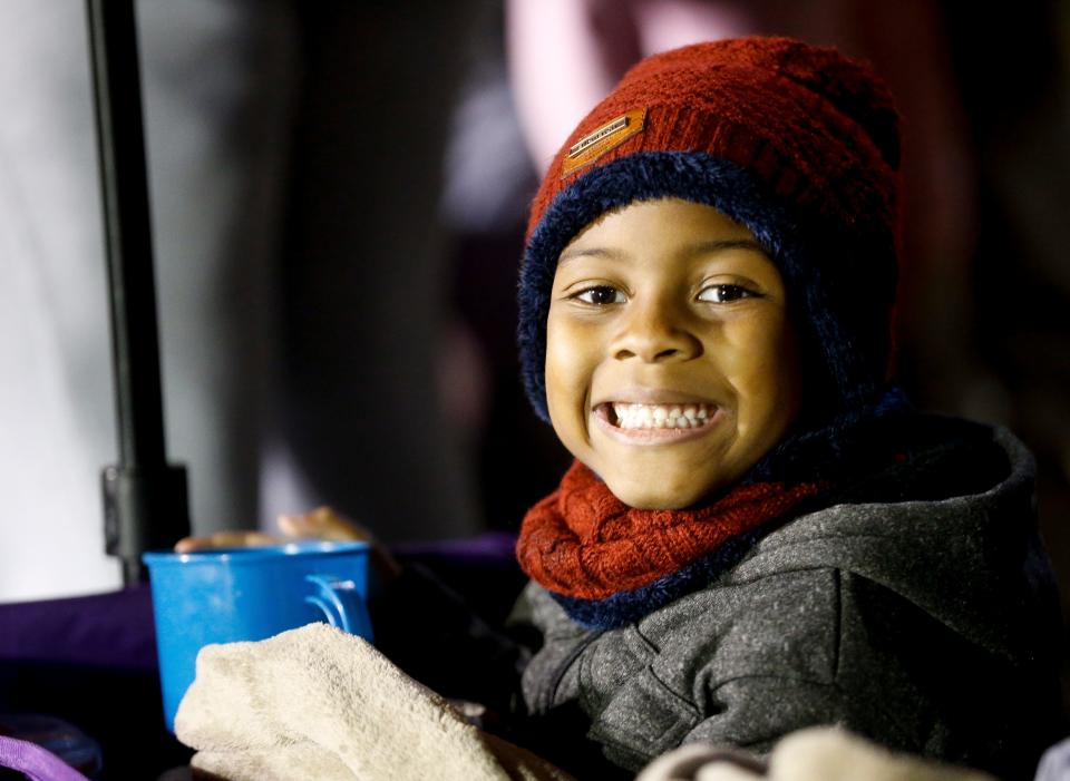 Taevion Underwood is all smiles while watching the 45th Annual West Alabama Christmas Parade as it returned to Tuscaloosa after a year off due to COVID-19 restrictions. The theme of the 2021 parade was “Super Heroes Celebrate Christmas.” [Staff Photo/Gary Cosby Jr.]