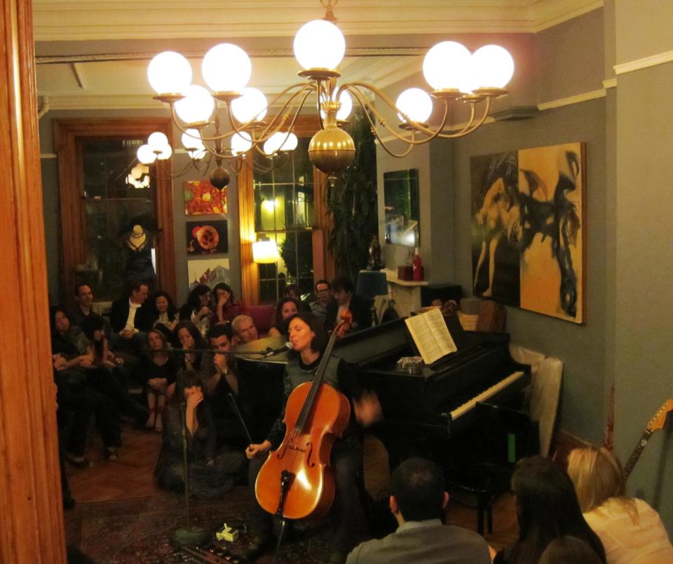 This image taken in 2011 shows cellist and singer Helen Gillet performing in a living room show, in the Brooklyn borough of New York. “The fans you make in a living room setting might go that extra mile for you, because you really connect,” said Gillet. Today, the living room show lives on, sometimes as a free exchange of talent among friends and acquaintances, other times as a hired performance. (AP Photo/John Tebeau)